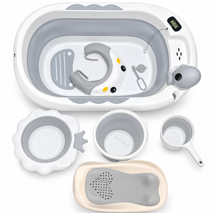 A baby bath tub set with a white and gray collapsible tub, matching accessories including a foot cradle, cup, scoop, and bath mat, arranged on a plain white background.