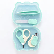 A small pet nail care kit in a translucent mint green bear-shaped case, containing mint green and cream nail scissors, tweezers, a nail file, and nail clippers on a white background.