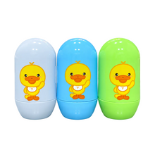 Three capsule-shaped baby bottles in white, blue, and green, each featuring a cartoon yellow duck holding a bib with the number 7, set against a solid light blue background.